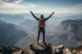 Mountain conqueror, successful hiker revels in panoramic view from triumphant summit