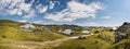 Mountain cottage hut or house on hill Velika Planina alpine meadow landscape. Eco farming. Kamnik Alps, Slovenia. Big Plateau. Pan Royalty Free Stock Photo