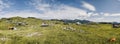 Mountain cottage hut or house on hill Velika Planina alpine meadow landscape. Eco farming. Kamnik Alps, Slovenia. Big Plateau. Pan Royalty Free Stock Photo