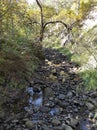 Mountain creek with lots of stones and crystal clear water Royalty Free Stock Photo