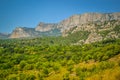 Mountain Crimea rocks and trees on slope, forest Royalty Free Stock Photo