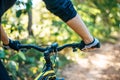 Mountain cyclists grasp the bike handle, focus on gloves
