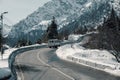 Mountain dangerous curved road in winter mountains. Winter Driving - Winter country road road