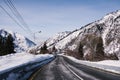 Mountain dangerous curved road in winter mountains. Winter Driving - Winter country road road