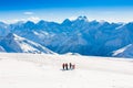 Mountain day winter. Elbrus. Men-women. snowboard and ski Royalty Free Stock Photo