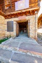 Entrance to the stone-wooden church in the Bulgarian village of Zheravna Royalty Free Stock Photo