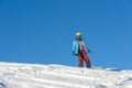 MOUNTAIN ELBRUS, RUSSIA - NOVEMBER 30, 2017: A snowboard girl wearing a sun mask and a scarf is riding down the alpine