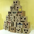 A mountain of emoticons carved from cardboard boxes. Funny, sad, angry and gullible Royalty Free Stock Photo