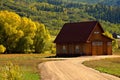 Mountain fall landscape surrounds a barn Royalty Free Stock Photo