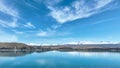 Mountain and farming country views of the shores of Lake Tekapo area near Roundhill Ski area