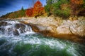 Mountain fast flowing river stream of water in the rocks at autumn Royalty Free Stock Photo