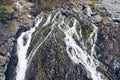 Mountain flowing stream and waterfall among the rocks and moss. Picturesque landscape view. Altai mountains, Siberia, Russia Royalty Free Stock Photo