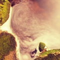 Mountain foamy stream among the green mossy stones Royalty Free Stock Photo