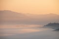 Mountain fog in morning sunrise landscape.beautiful view of mountain range in the mist background.Mountain valley texture in Royalty Free Stock Photo