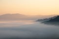 Mountain fog in morning sunrise landscape.beautiful view of mountain range in the mist background.Mountain valley texture in Royalty Free Stock Photo