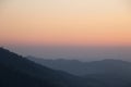 Mountain fog in morning sunrise landscape.beautiful view of mountain range in the mist background.Mountain valley texture in Royalty Free Stock Photo