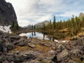 Mountain forest lake among large rocks Royalty Free Stock Photo