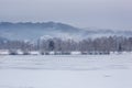 Mountain and forest landscape in the mist with snow Royalty Free Stock Photo