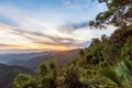 Mountain forest landscape under sunrise sky with clouds Royalty Free Stock Photo