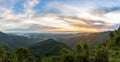 Mountain forest landscape under sunrise sky with clouds Royalty Free Stock Photo