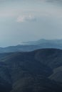 Vertical nature screensaver. Minimalism. Mountain forests and sea can be seen on horizon in distance. Mountain view of forest and