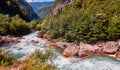 Mountain fresh and cold river in summer time under cloudy sunny blue sky Royalty Free Stock Photo