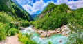 Mountain fresh and cold river in summer time under cloudy sunny blue sky Royalty Free Stock Photo