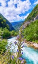 Mountain fresh and cold river in summer time under cloudy sunny blue sky Royalty Free Stock Photo