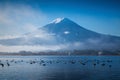 Mountain Fuji and Kawaguchiko lake with morning mist in autumn s Royalty Free Stock Photo