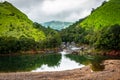 Mountain gap with river flowing and green forests