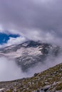 mountain and glacier field in summer with stones