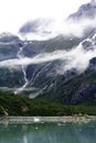 Mountain Glacier Rivulet with Whispy Clouds