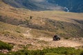 Mountain gravel road with ATV quadbike. Kapalskiy vzvoz mountain pass. Road to Burkhan-bulak waterfall. Travel, tourism in Royalty Free Stock Photo