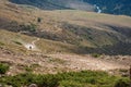 Mountain gravel road with ATV quadbike. Kapalskiy vzvoz mountain pass. Road to Burkhan-bulak waterfall. Travel, tourism in Royalty Free Stock Photo