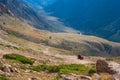 Mountain gravel road with ATV quadbike. Kapalskiy vzvoz mountain pass. Road to Burkhan-bulak waterfall. Travel, tourism in Royalty Free Stock Photo