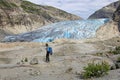 A mountain guide in front of Nigardsbreen, a glacier arm of the large Jostedalsbreen glacier, Norway, Europe