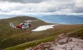 Mountain helicopter rescue action by coastguard on Ben Nevis, Scotland,Fort William, Scotland, UK