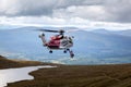 Mountain helicopter rescue action by coastguard on Ben Nevis, Scotland,Fort William, Scotland, UK