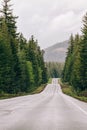 Mountain highway with cars in a distance Royalty Free Stock Photo