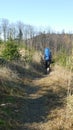 Mountain hiker with backpack on the trail.