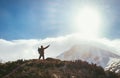 Mountain hiker greeting the sun in Highlands