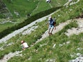 Mountain hikers on the alpine peak of Margelchopf in the Alviergruppe mountain range