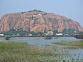 Mountain hillock hills cave lake view plantation fertile ruralscape hindu temple watertank waterbody Royalty Free Stock Photo