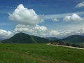 Mountain horizon with blue and cloudy sky