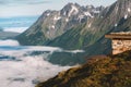 Mountain hut landscape in Norway aerial clouds view Sunnmore Alps travel beautiful destinations scenery Royalty Free Stock Photo