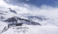 Mountain huts on the tops of towering Alps. Royalty Free Stock Photo