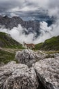 Mountain ibex with Mt. Duranno Dolomiti Friulane in the backgrounds Royalty Free Stock Photo