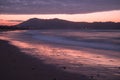 Mountain Jaizkibel backlit on atlantic coastline in beautiful pink sunset, hendaye, france Royalty Free Stock Photo