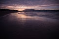 Mountain Jaizkibel backlit on atlantic coastline in beautiful pink sunset, hendaye, france Royalty Free Stock Photo