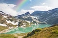Rainbow over mountain lake in alps, Austria Royalty Free Stock Photo